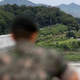 A South Korean soldier overlooking the DMZ between the two countries.